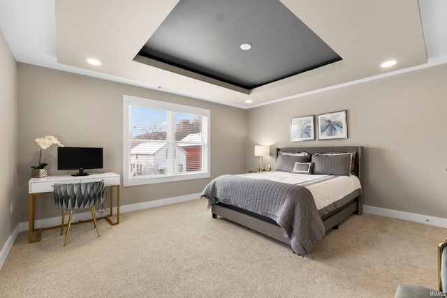 bedroom with a tray ceiling, carpet, recessed lighting, and baseboards