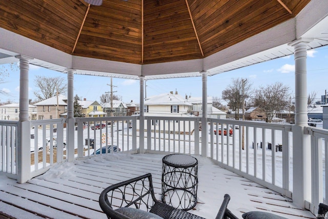 wooden terrace featuring a residential view and a gazebo