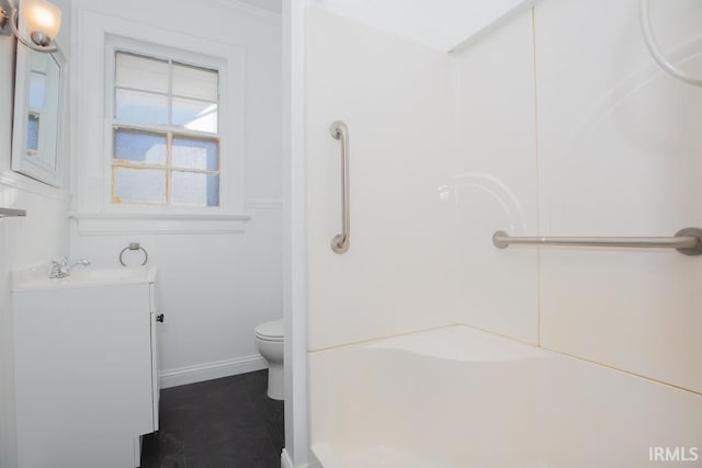 full bath with a shower, baseboards, vanity, and toilet