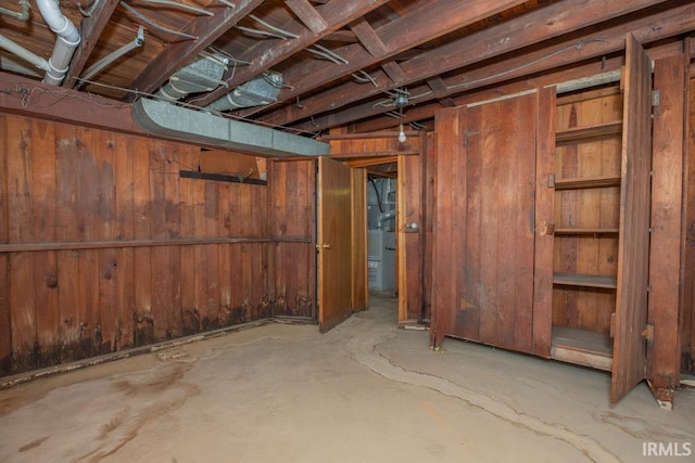 unfinished basement with wood walls