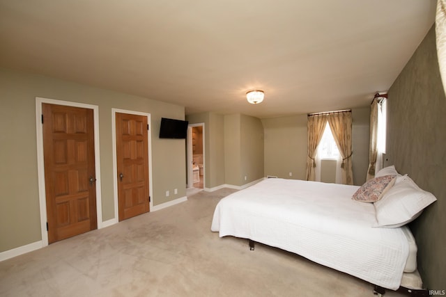 carpeted bedroom with baseboards