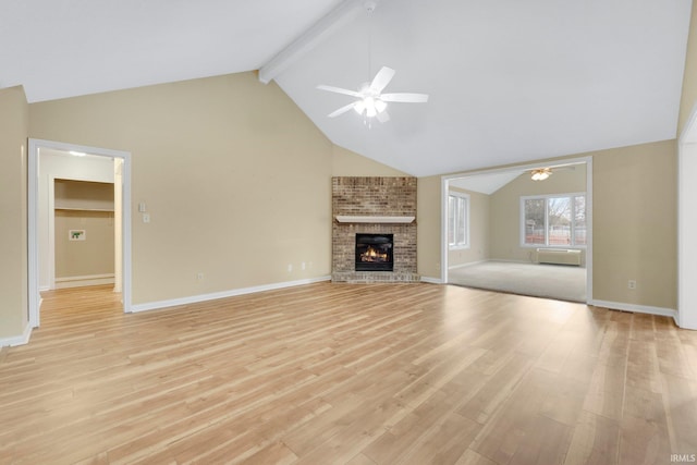 unfurnished living room featuring baseboards, ceiling fan, beamed ceiling, light wood-style floors, and a fireplace