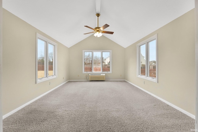 unfurnished room with vaulted ceiling, ceiling fan, light colored carpet, and baseboards