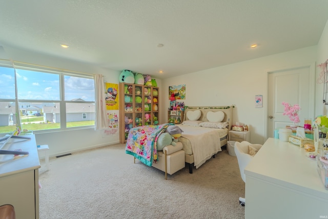 bedroom featuring recessed lighting, visible vents, baseboards, and light colored carpet