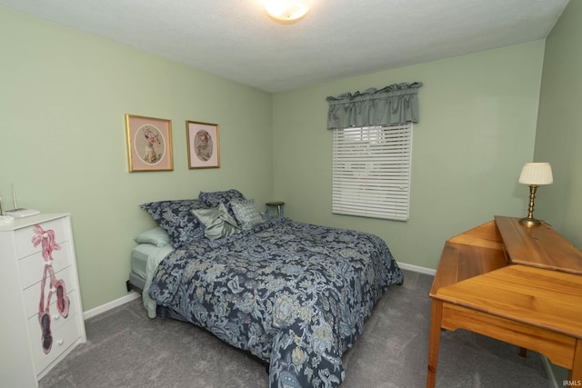 bedroom with carpet, baseboards, and a textured ceiling