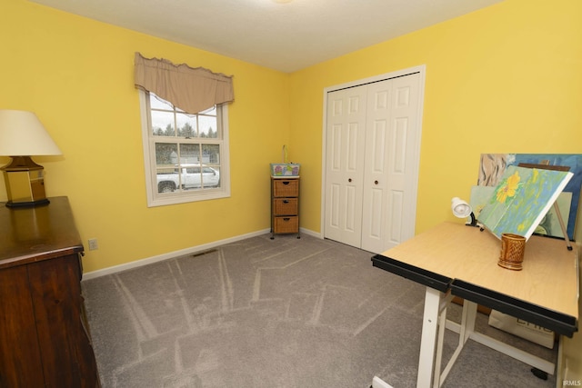 unfurnished office with carpet, baseboards, and visible vents