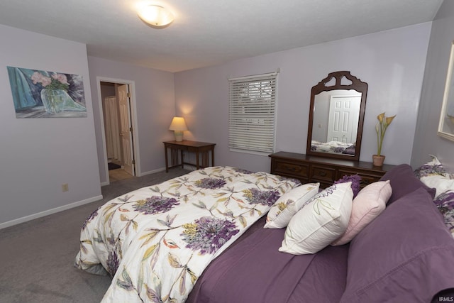 carpeted bedroom featuring baseboards