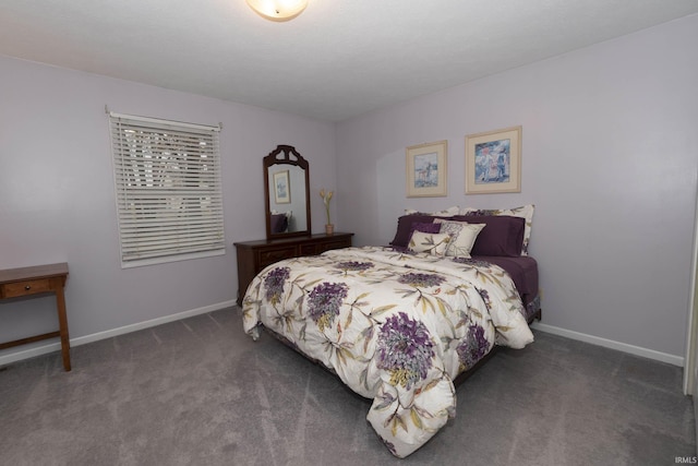 bedroom with carpet and baseboards