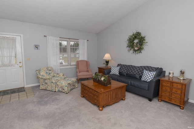 living room featuring light carpet, light tile patterned floors, vaulted ceiling, and baseboards