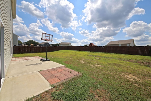 view of yard with a fenced backyard and a patio