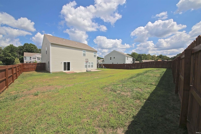 view of yard with a fenced backyard and a patio