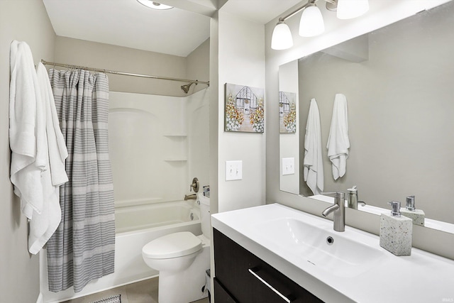 bathroom with shower / bath combo, vanity, and toilet