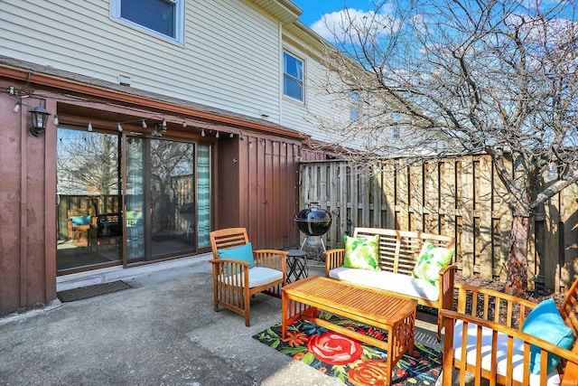 view of patio with fence and grilling area