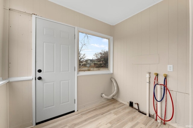 laundry area featuring hookup for a washing machine, laundry area, and light wood-style flooring