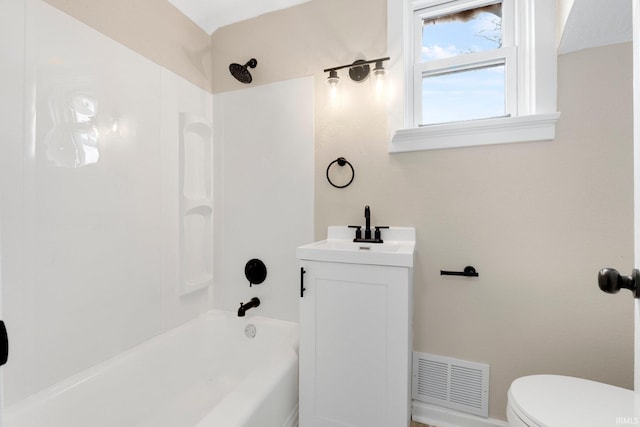 bathroom featuring visible vents, vanity, toilet, and tub / shower combination