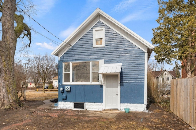 back of property with fence