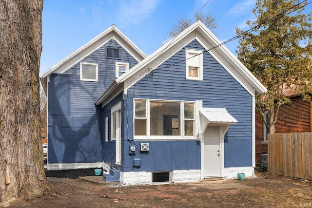 view of front of home with fence