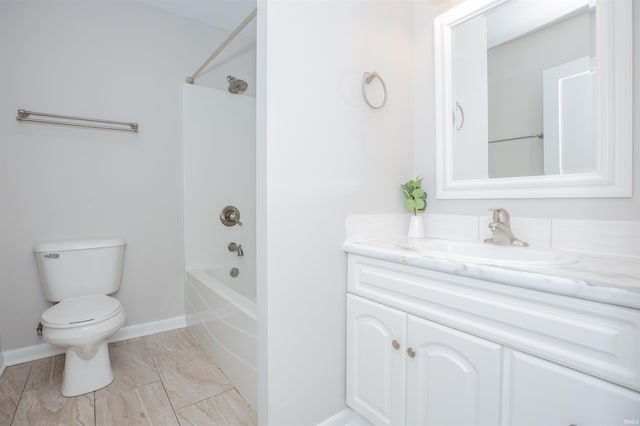 bathroom featuring toilet, shower / tub combination, baseboards, and vanity