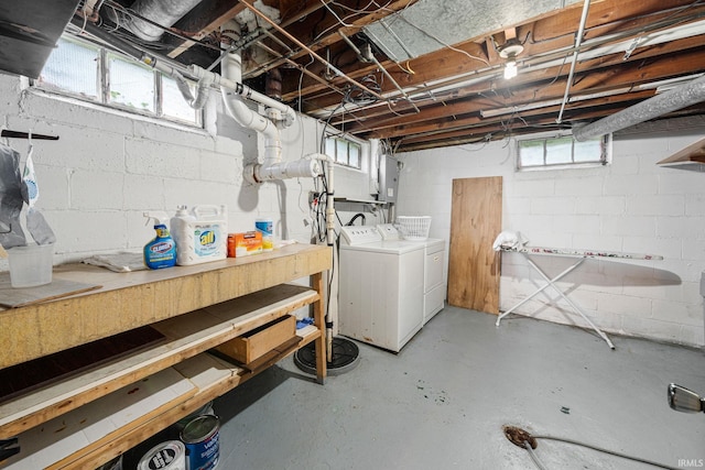 below grade area with electric panel and separate washer and dryer