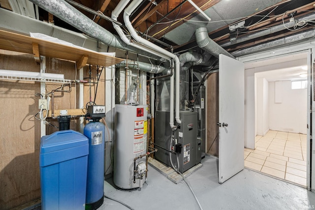 utility room with heating unit and gas water heater