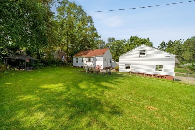 view of yard with fence and a gazebo