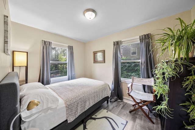 bedroom featuring wood finished floors