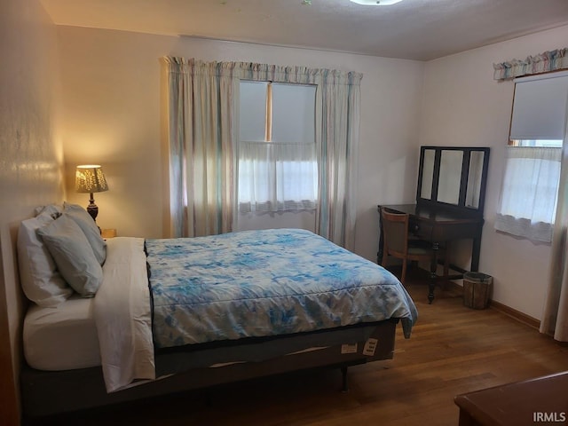 bedroom with wood finished floors