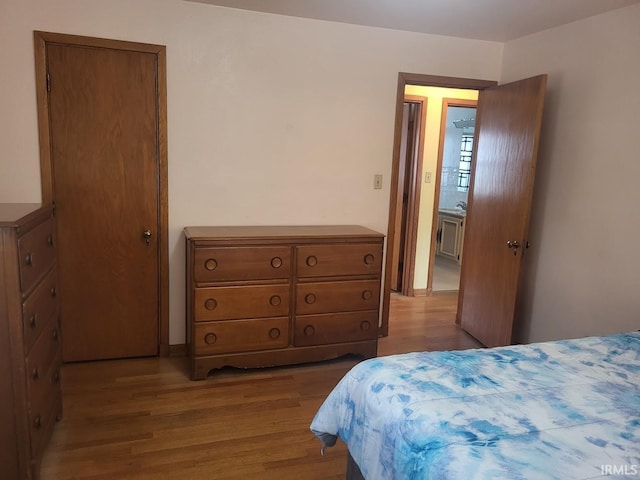 bedroom with wood finished floors