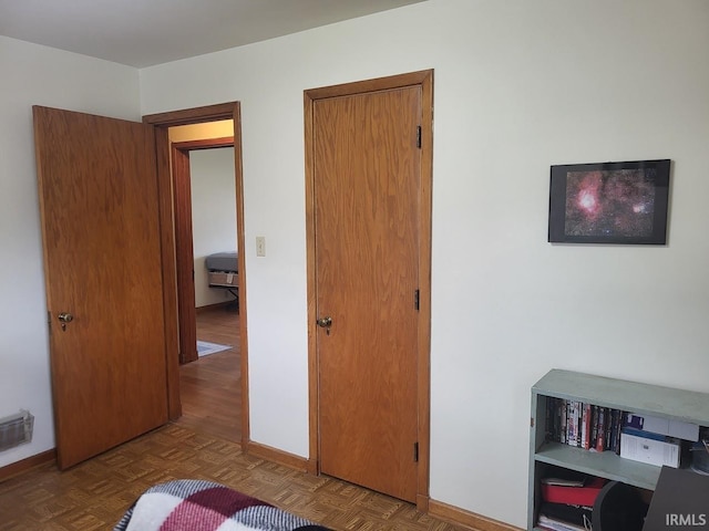 bedroom featuring visible vents and baseboards