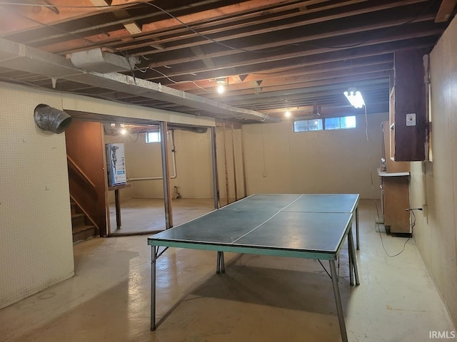 recreation room featuring concrete floors