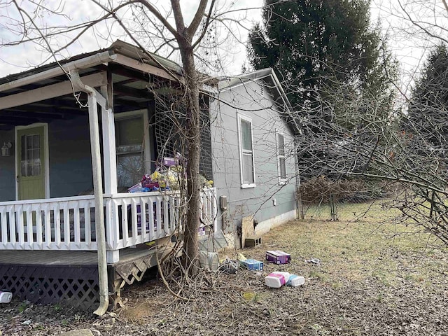 view of home's exterior featuring covered porch