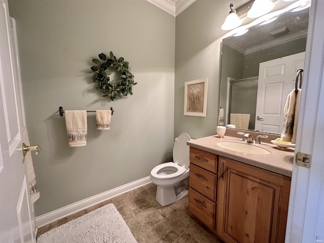 full bathroom featuring toilet, vanity, baseboards, a shower stall, and crown molding