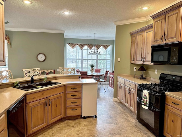 kitchen with black appliances, a sink, light countertops, and crown molding