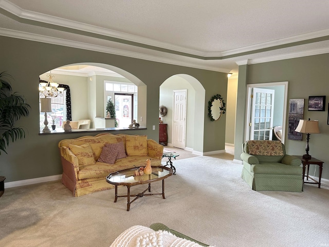 living area with light carpet, baseboards, and ornamental molding