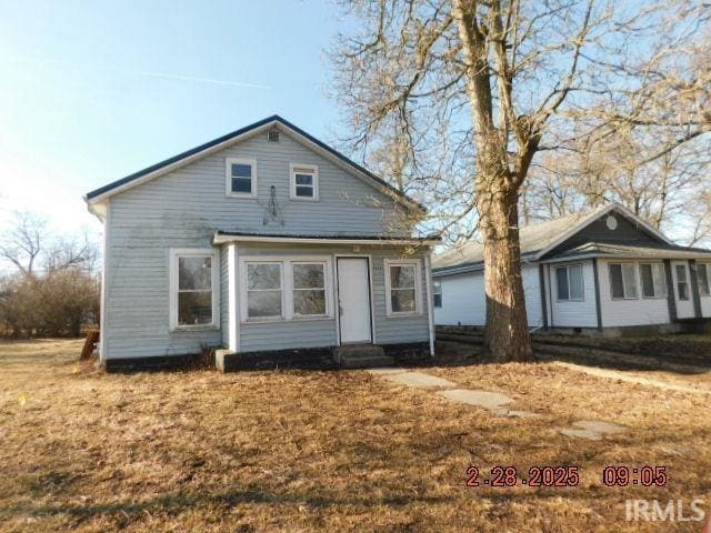 rear view of house with entry steps