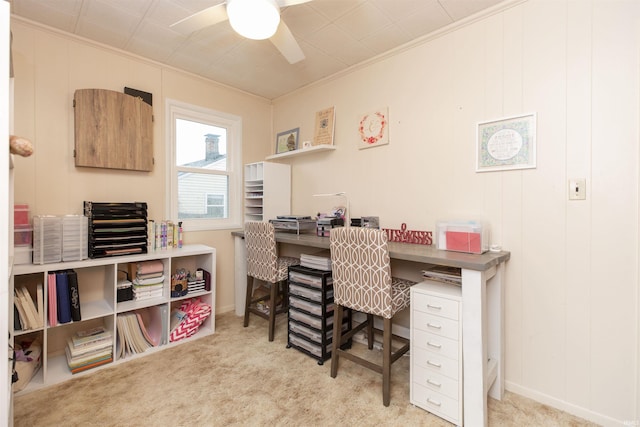 carpeted office featuring ceiling fan, ornamental molding, and baseboards