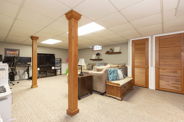 interior space featuring light colored carpet and a drop ceiling