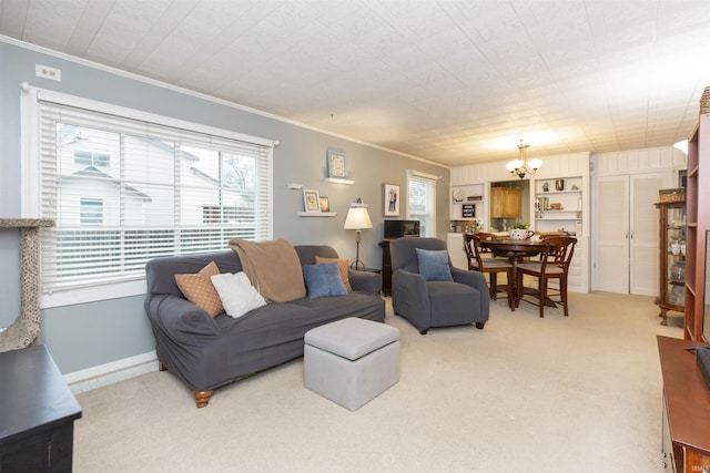 living room with light carpet, crown molding, a notable chandelier, and baseboards