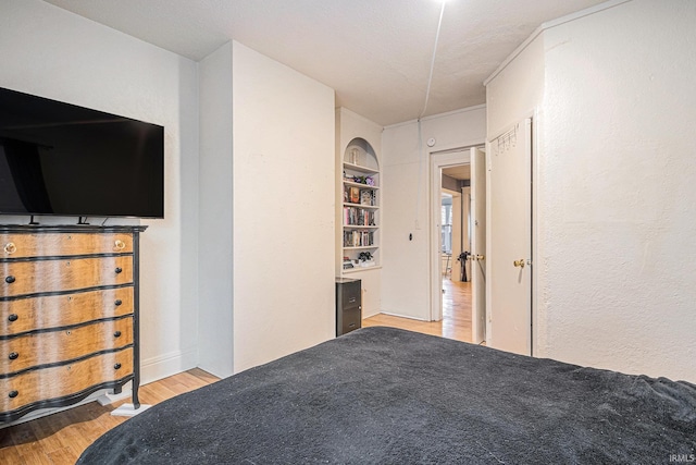 unfurnished bedroom with light wood-style flooring