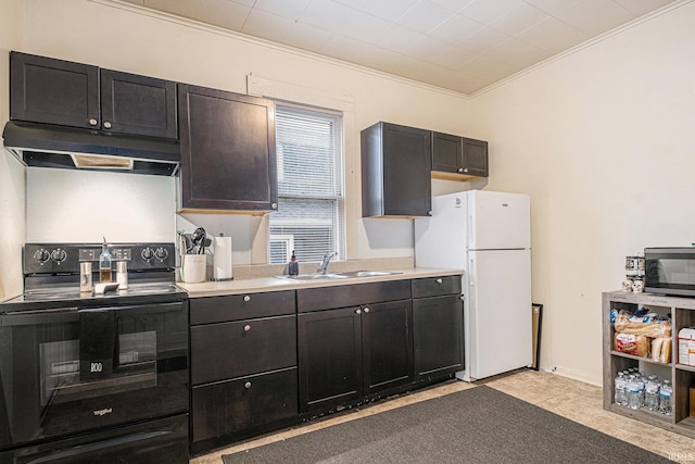 kitchen with electric range, stainless steel microwave, freestanding refrigerator, under cabinet range hood, and a sink