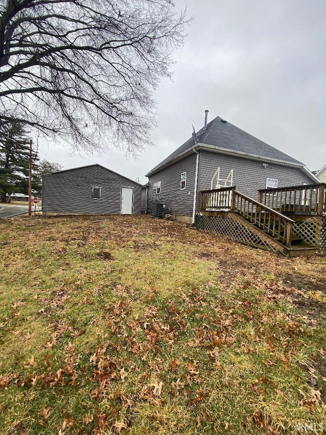 exterior space featuring an outdoor structure and a deck