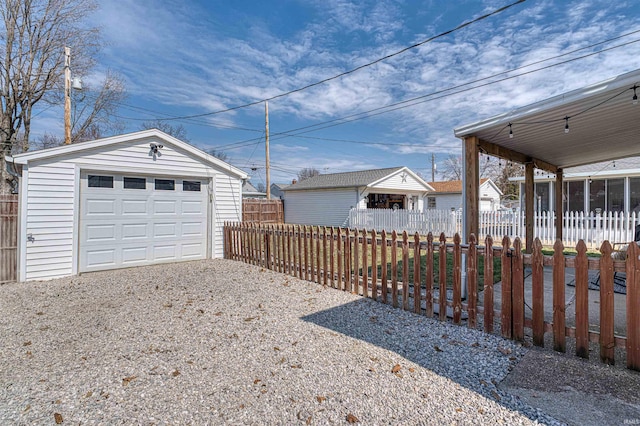 exterior space with driveway and fence