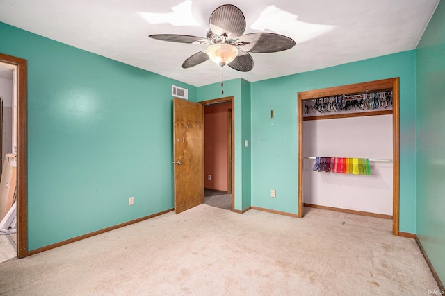 unfurnished bedroom featuring ceiling fan, carpet flooring, visible vents, baseboards, and a closet