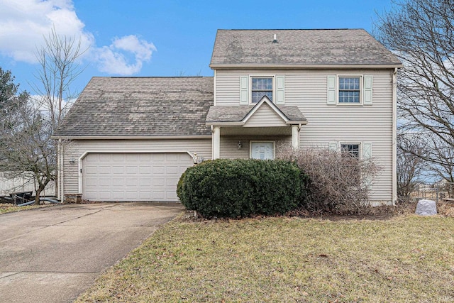 view of front of home featuring a shingled roof, a front yard, driveway, and an attached garage