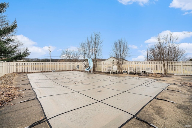 view of swimming pool featuring a patio and a fenced backyard