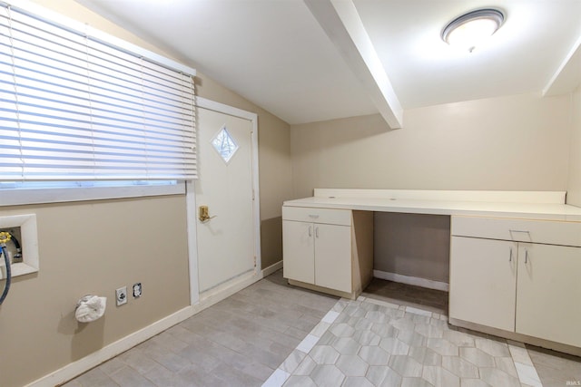 laundry room with washer hookup, cabinet space, and baseboards