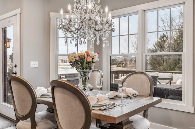 dining area with a notable chandelier