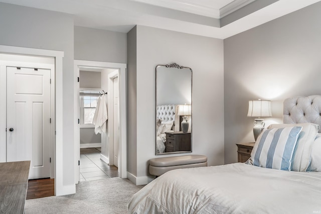 bedroom featuring ornamental molding, carpet flooring, and baseboards