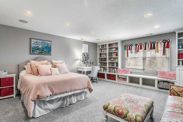 bedroom with a textured ceiling, carpet floors, and recessed lighting