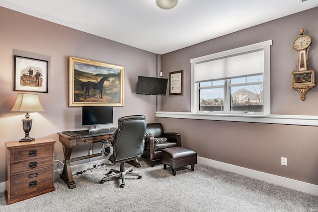 office featuring carpet flooring, visible vents, and baseboards